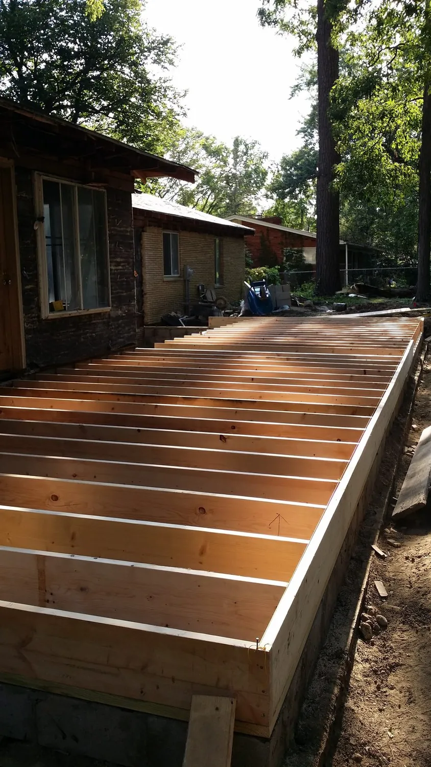 Porch floor joists framed and squared on the foundation